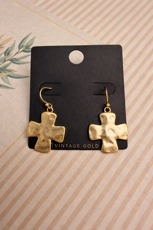 Hammered Look Gold cross earrings on a black card with 'Vintage Gold' text, against a striped beige background.